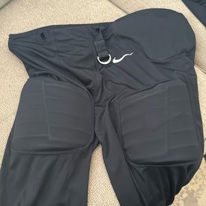 Youth Dri-fit Nike football pants with integrated pads.